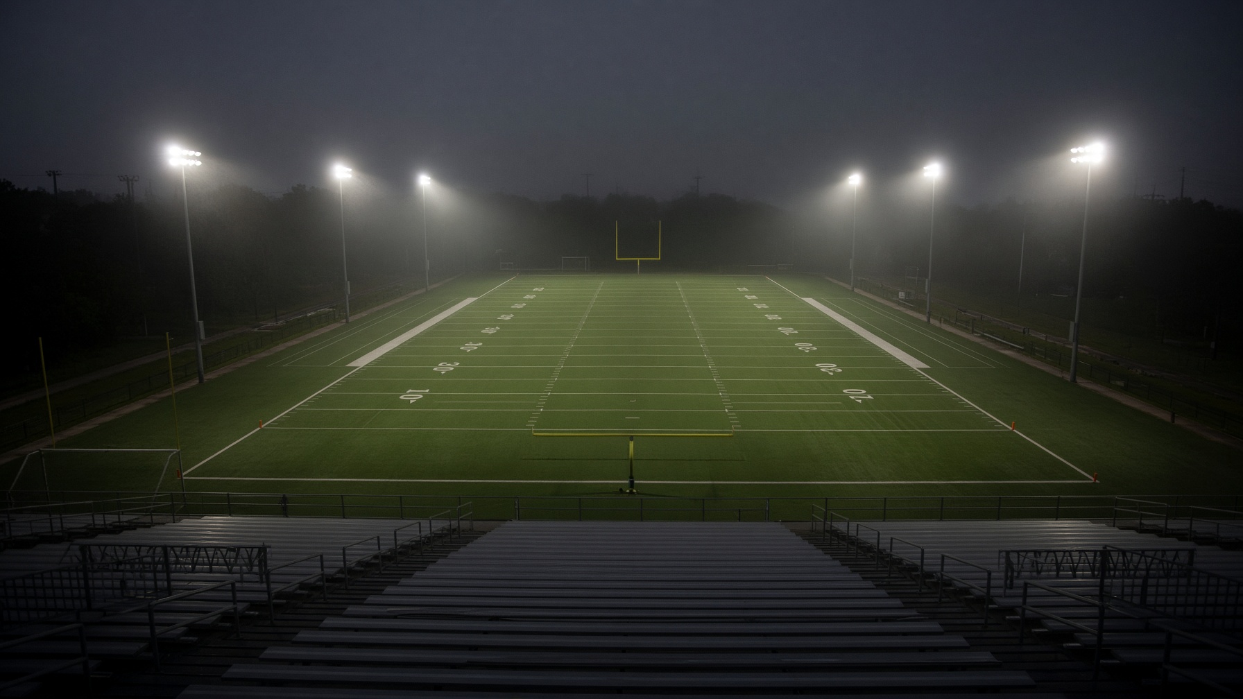 Press box view of a high school field under the lights